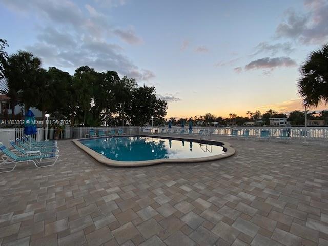 1455 N Treasure Dr Unit 4N, North Bay Village, FL 33141 - community pool featuring a patio and fence