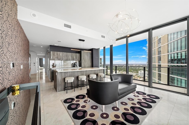 480 NE 31st St Unit 4207, Miami, FL 33137 - living area with expansive windows and a chandelier