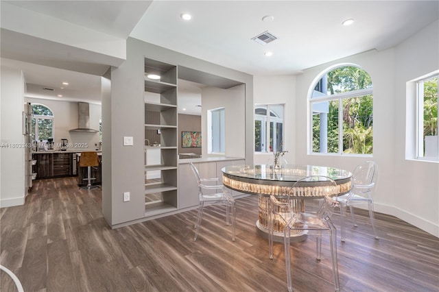 5978 Alton Rd, Miami Beach, FL 33140 - dining room featuring dark wood-type flooring, baseboards, and recessed lighting