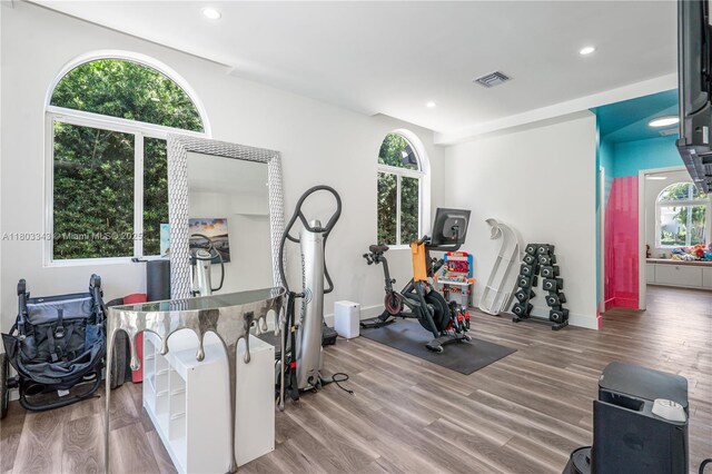 5978 Alton Rd, Miami Beach, FL 33140 - workout room with plenty of natural light, wood finished floors, recessed lighting, and baseboards