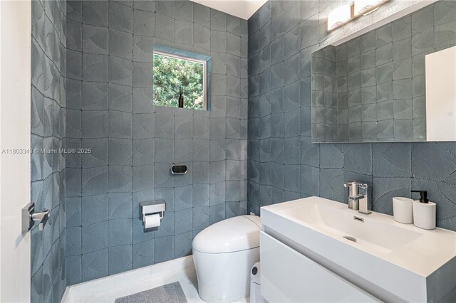 5978 Alton Rd, Miami Beach, FL 33140 - bathroom with tile walls, toilet, and vanity