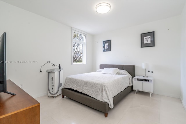 5978 Alton Rd, Miami Beach, FL 33140 - bedroom featuring light tile patterned flooring and baseboards