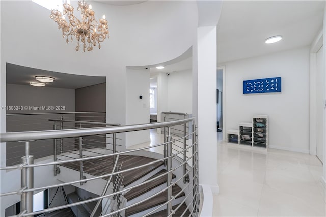 5978 Alton Rd, Miami Beach, FL 33140 - hallway featuring a chandelier, an upstairs landing, tile patterned flooring, baseboards, and recessed lighting