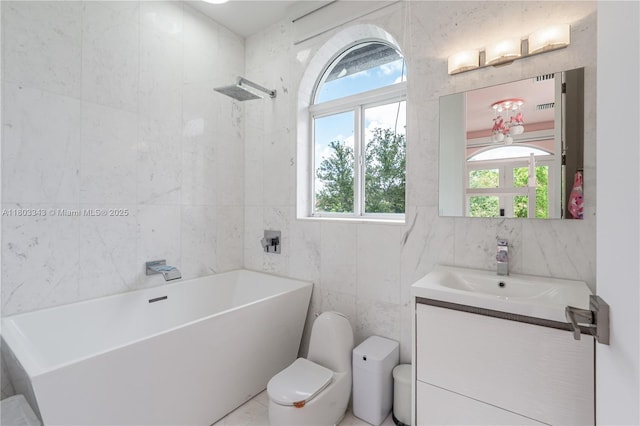 5978 Alton Rd, Miami Beach, FL 33140 - bathroom featuring tile walls, vanity, toilet, a freestanding bath, and a shower