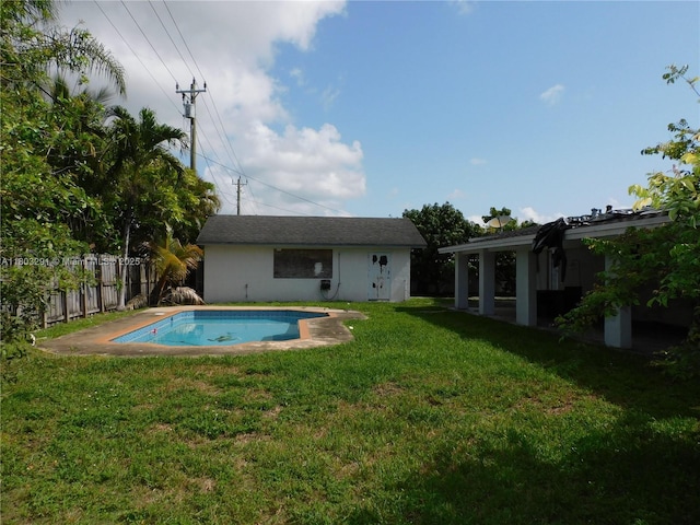 rear view of house with an outdoor structure and stucco siding