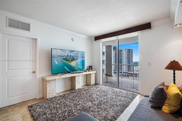 170 SE 14th St Unit 2805, Miami, FL 33131 - living room featuring ornamental molding and a textured ceiling