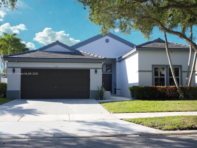 1132 Cedar Falls Dr, Weston, FL 33327 - ranch-style home with a garage, concrete driveway, and stucco siding