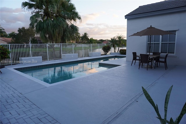 1132 Cedar Falls Dr, Weston, FL 33327 - pool at dusk with a patio