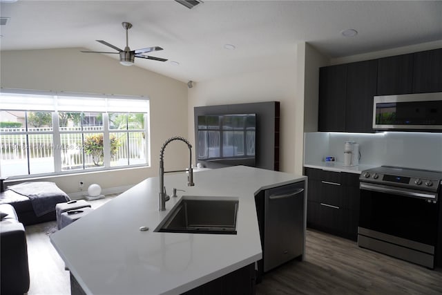 1132 Cedar Falls Dr, Weston, FL 33327 - kitchen with stainless steel appliances, dark cabinetry, light countertops, ceiling fan, and lofted ceiling