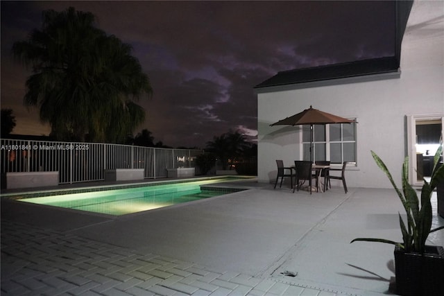 1132 Cedar Falls Dr, Weston, FL 33327 - pool at night featuring a patio area