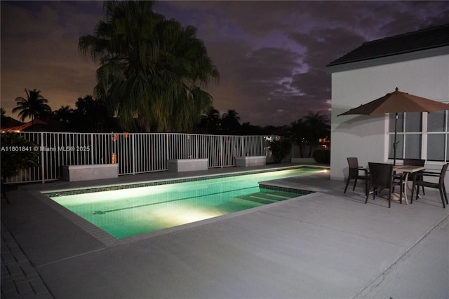 1132 Cedar Falls Dr, Weston, FL 33327 - pool at twilight featuring a patio