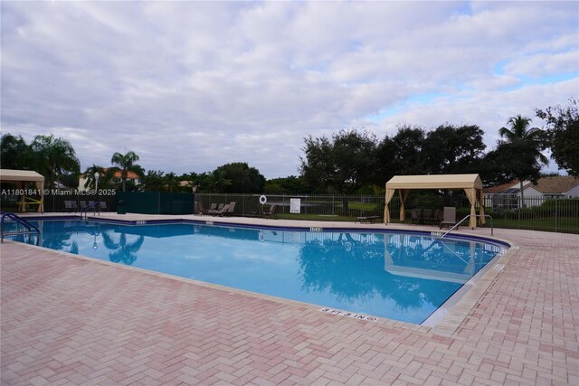 1132 Cedar Falls Dr, Weston, FL 33327 - community pool featuring a patio area and a gazebo