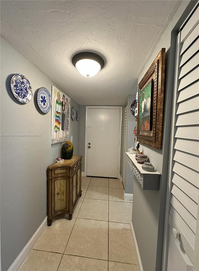 13707 Kendale Lakes Cir Unit 110, Miami, FL 33183 - hall featuring light tile patterned flooring and a textured ceiling