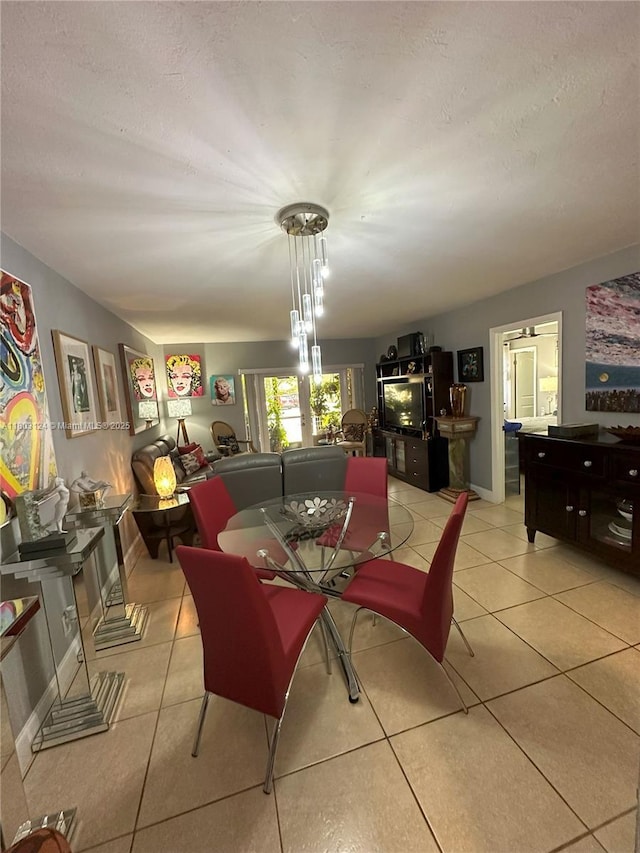 13707 Kendale Lakes Cir Unit 110, Miami, FL 33183 - dining area featuring light tile patterned flooring and a textured ceiling