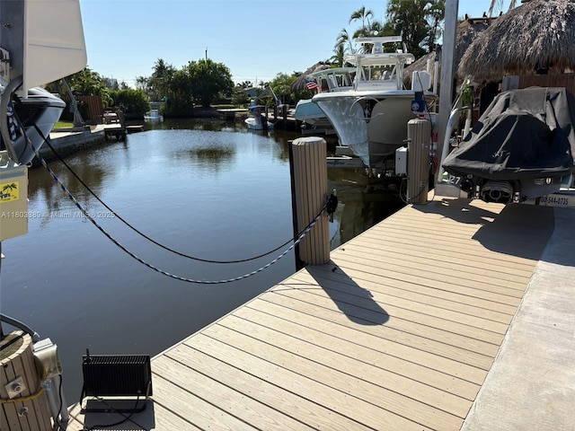 963 Nautilus Isle, Dania Beach, FL 33004 - dock area featuring a water view and boat lift