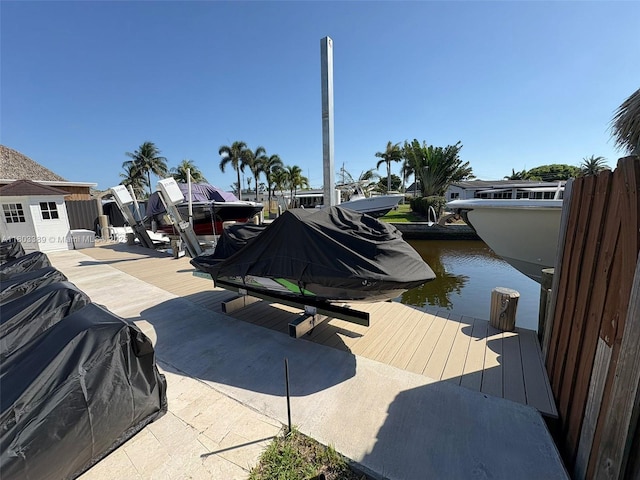 963 Nautilus Isle, Dania Beach, FL 33004 - dock featuring boat lift and a water view