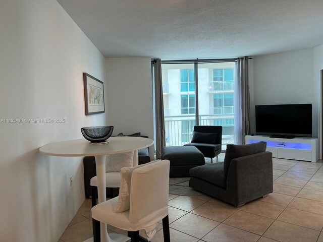 9066 SW 73rd Ct Unit 1703, Miami, FL 33156 - living area featuring light tile patterned floors and floor to ceiling windows