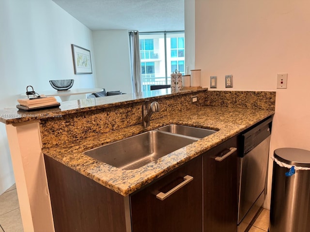 9066 SW 73rd Ct Unit 1703, Miami, FL 33156 - kitchen featuring dishwasher, a sink, light tile patterned flooring, and stone countertops
