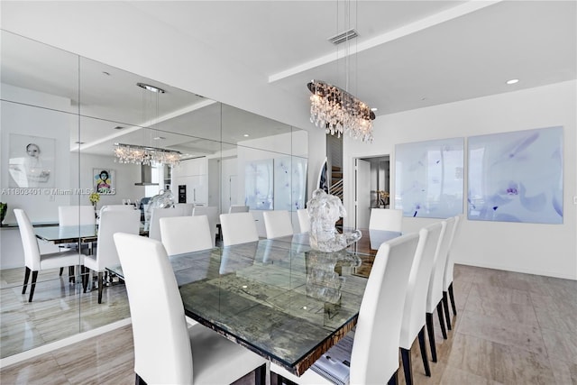 1445 16th St Unit Ph-4, Miami Beach, FL 33139 - dining space with a chandelier and baseboards