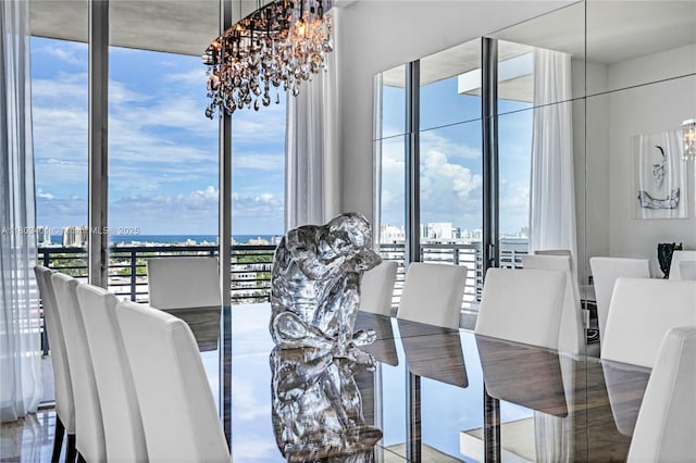1445 16th St Unit Ph-4, Miami Beach, FL 33139 - dining area featuring a chandelier and expansive windows
