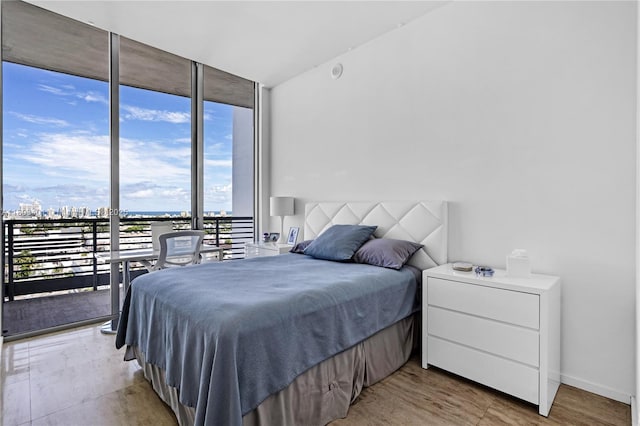 1445 16th St Unit Ph-4, Miami Beach, FL 33139 - bedroom with floor to ceiling windows, access to exterior, and a view of city