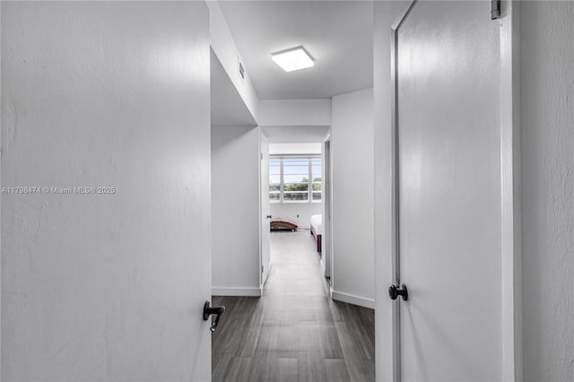 1780 NE 191st St Unit 501-2, Miami, FL 33179 - hallway featuring wood finished floors and baseboards