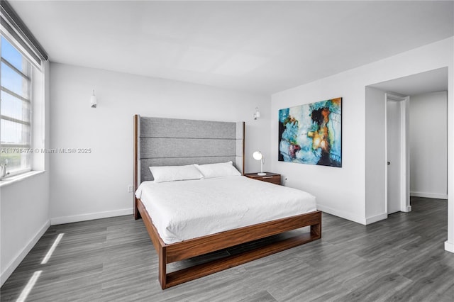 1780 NE 191st St Unit 501-2, Miami, FL 33179 - bedroom with wood finished floors and baseboards