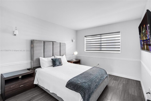 1780 NE 191st St Unit 501-2, Miami, FL 33179 - bedroom featuring wood finished floors and baseboards