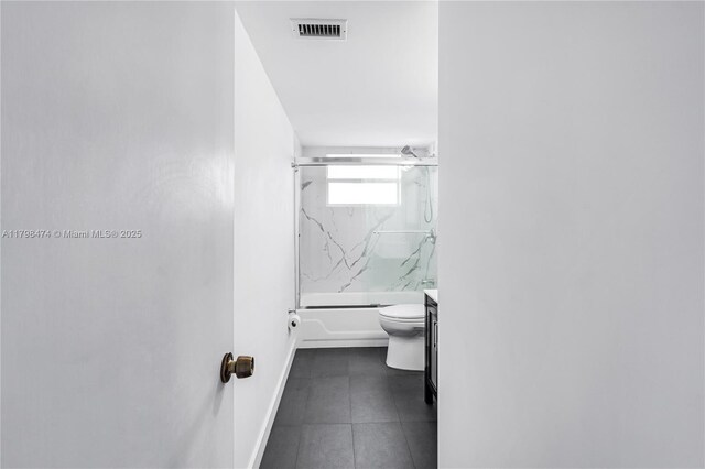 1780 NE 191st St Unit 501-2, Miami, FL 33179 - bathroom with baseboards, tile patterned flooring, combined bath / shower with glass door, toilet, and vanity