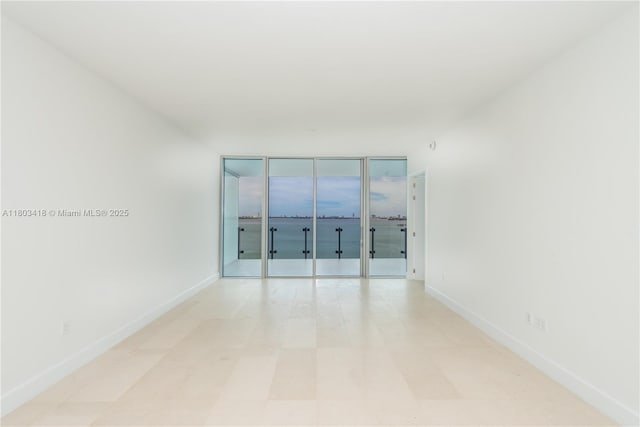 700 NE 26th Ter Unit 903, Miami, FL 33137 - spare room featuring baseboards