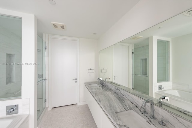 700 NE 26th Ter Unit 903, Miami, FL 33137 - bathroom with a bath, a shower stall, double vanity, and tile patterned floors