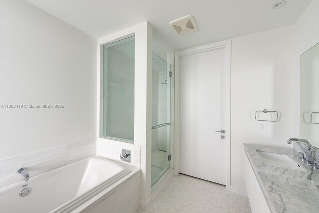 700 NE 26th Ter Unit 903, Miami, FL 33137 - bathroom featuring a stall shower, a bath, and vanity