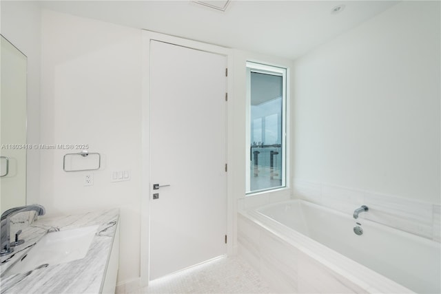 700 NE 26th Ter Unit 903, Miami, FL 33137 - bathroom with a garden tub and vanity
