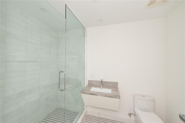 700 NE 26th Ter Unit 903, Miami, FL 33137 - full bathroom featuring a sink, toilet, and a stall shower