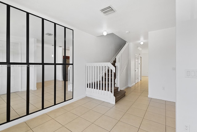9153 SW 227th St Unit 3, Cutler Bay, FL 33190 - spare room featuring light tile patterned floors, stairs, and baseboards