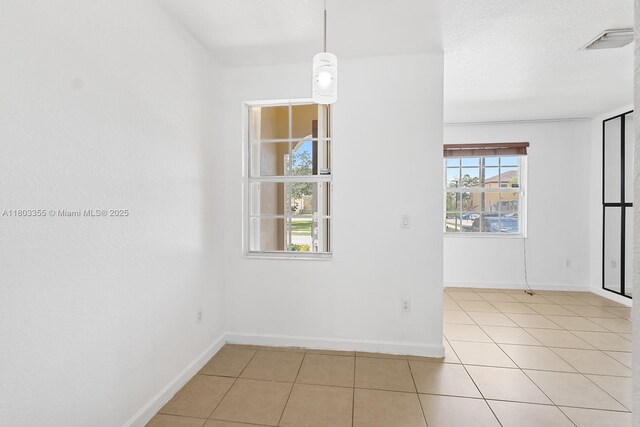 9153 SW 227th St Unit 3, Cutler Bay, FL 33190 - spare room with light tile patterned flooring and baseboards