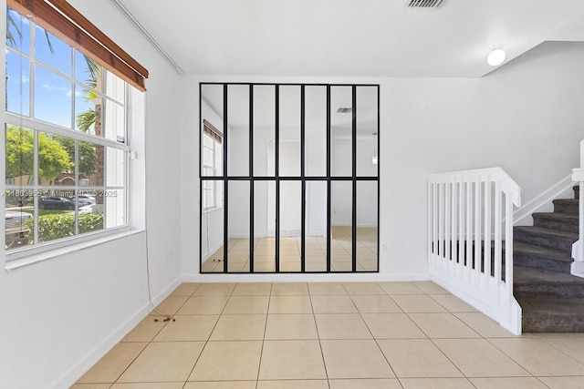 9153 SW 227th St Unit 3, Cutler Bay, FL 33190 - tiled spare room with stairs and baseboards