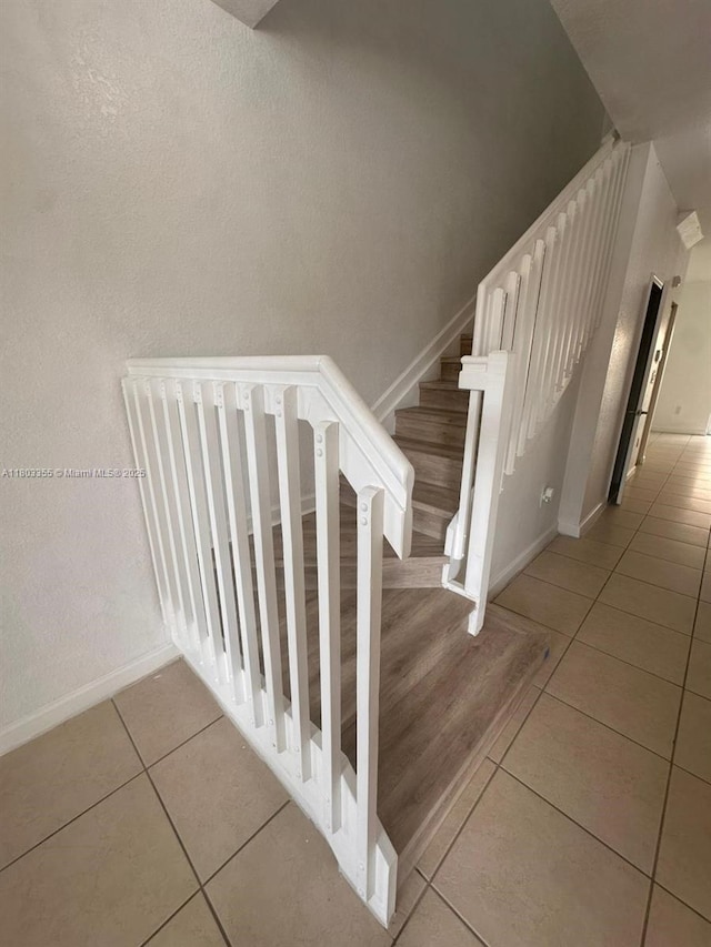 9153 SW 227th St Unit 3, Cutler Bay, FL 33190 - stairway with tile patterned flooring and baseboards
