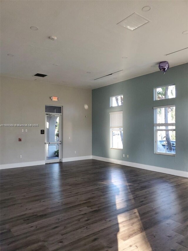9153 SW 227th St Unit 3, Cutler Bay, FL 33190 - spare room featuring dark wood-style flooring, baseboards, and a smoke detector