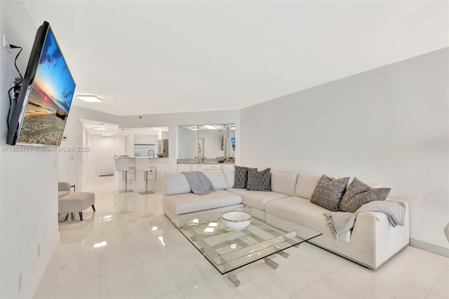 9650 S Ocean Dr Unit 2003, Jensen Beach, FL 34957 - living area featuring baseboards and light tile patterned flooring