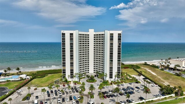 9650 S Ocean Dr Unit 2003, Jensen Beach, FL 34957 - drone / aerial view of waterfront with a beach and apartment complex