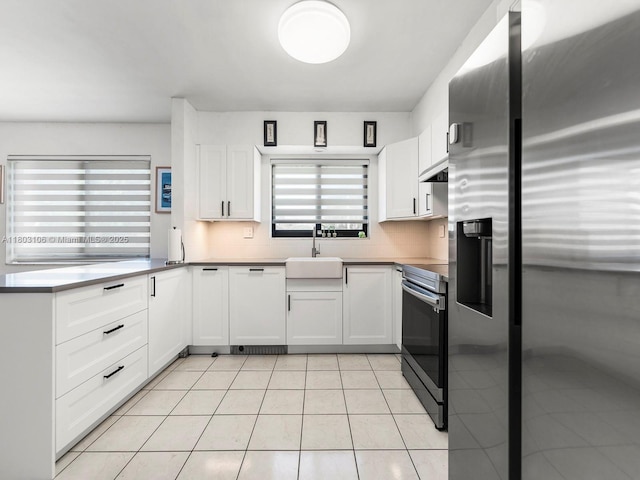 2720 SW 76th Ave, Miami, FL 33155 - kitchen with stainless steel appliances, a sink, under cabinet range hood, and white cabinets