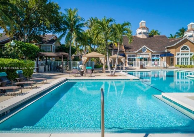 10670 SW 156th Pl Unit 313, Miami, FL 33196 - community pool with a patio area