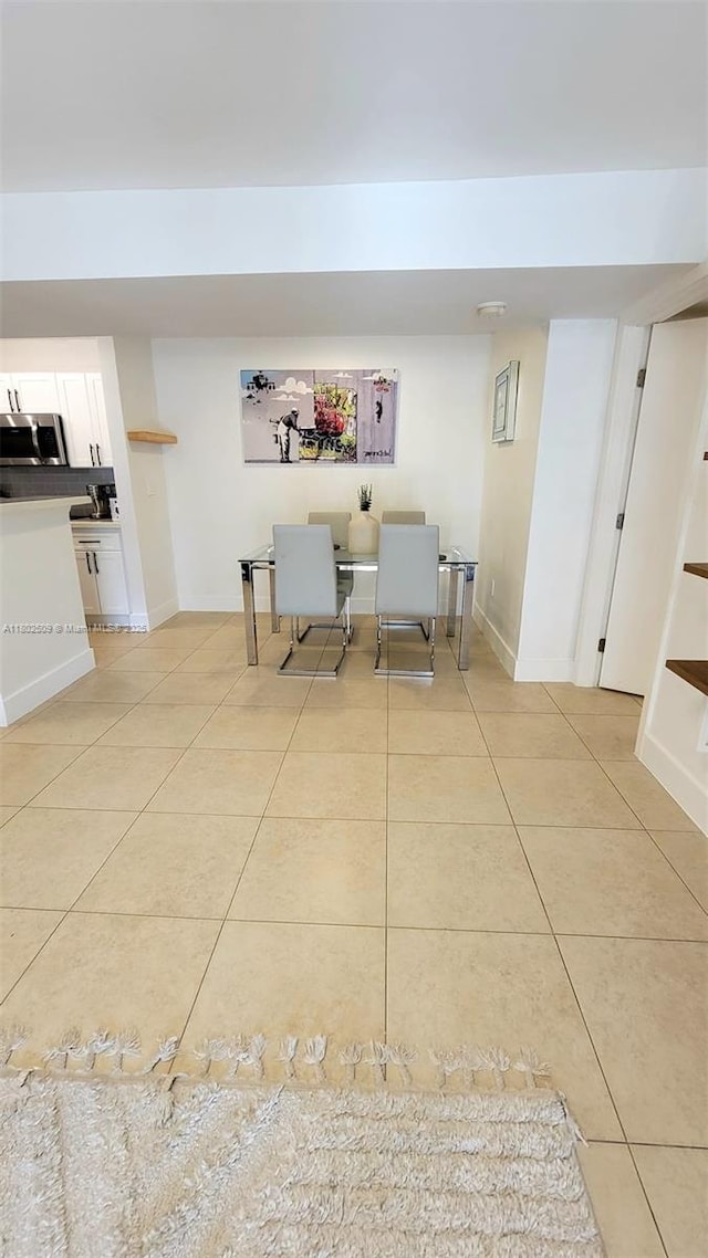 10670 SW 156th Pl Unit 313, Miami, FL 33196 - dining space featuring light tile patterned floors and baseboards