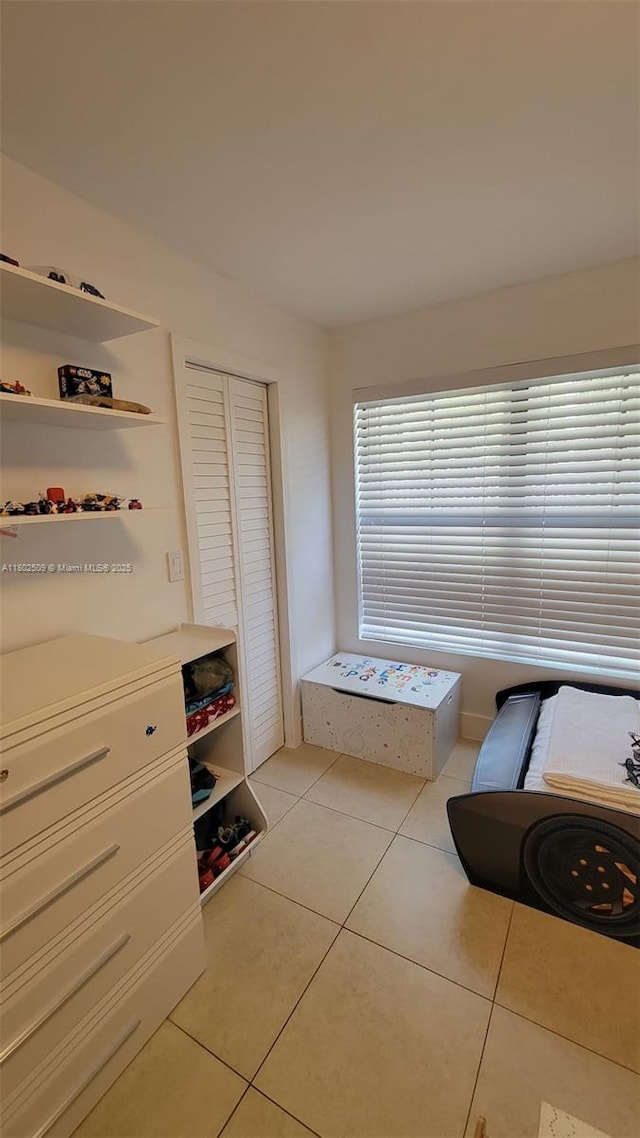 10670 SW 156th Pl Unit 313, Miami, FL 33196 - sitting room with light tile patterned floors