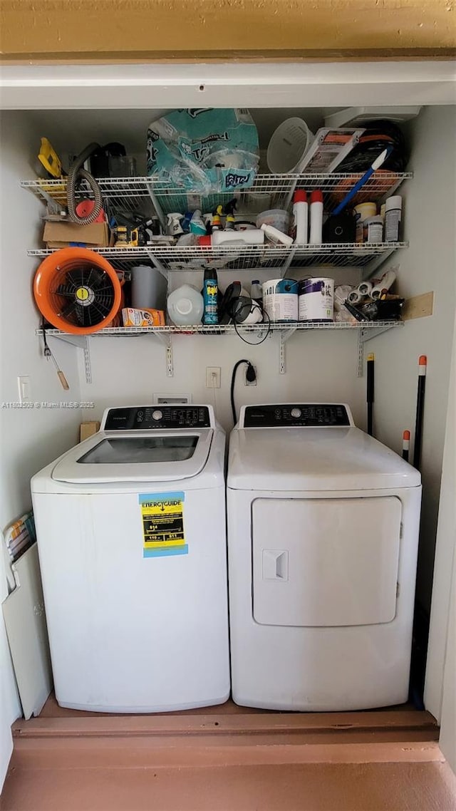 10670 SW 156th Pl Unit 313, Miami, FL 33196 - washroom with washing machine and dryer and wood finished floors