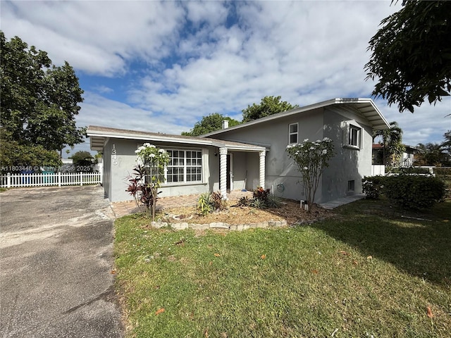 1345 NE 199th St, Miami, FL 33179 - view of front of house featuring stucco siding and driveway