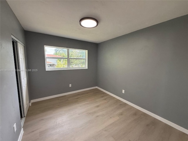 1345 NE 199th St, Miami, FL 33179 - spare room with light wood-style flooring and baseboards