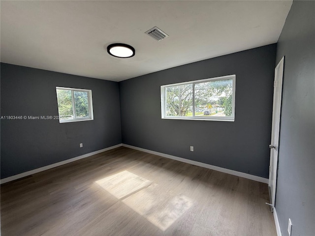 1345 NE 199th St, Miami, FL 33179 - unfurnished room with wood finished floors and baseboards