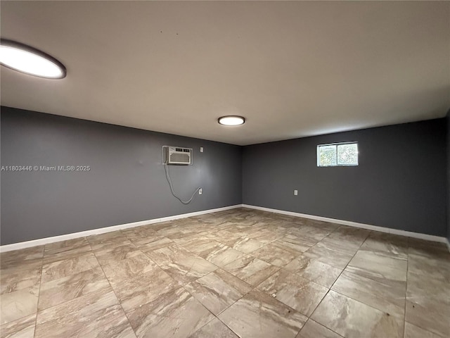 1345 NE 199th St, Miami, FL 33179 - unfurnished room featuring marble look tile flooring, baseboards, and an AC wall unit
